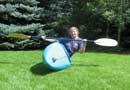  Picture of Mandy Kotzman balancing a whitewater kayak on edge